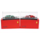 Two Looksmart 1:43 scale diecast model racing vehicles with boxes and display cases comprising Le