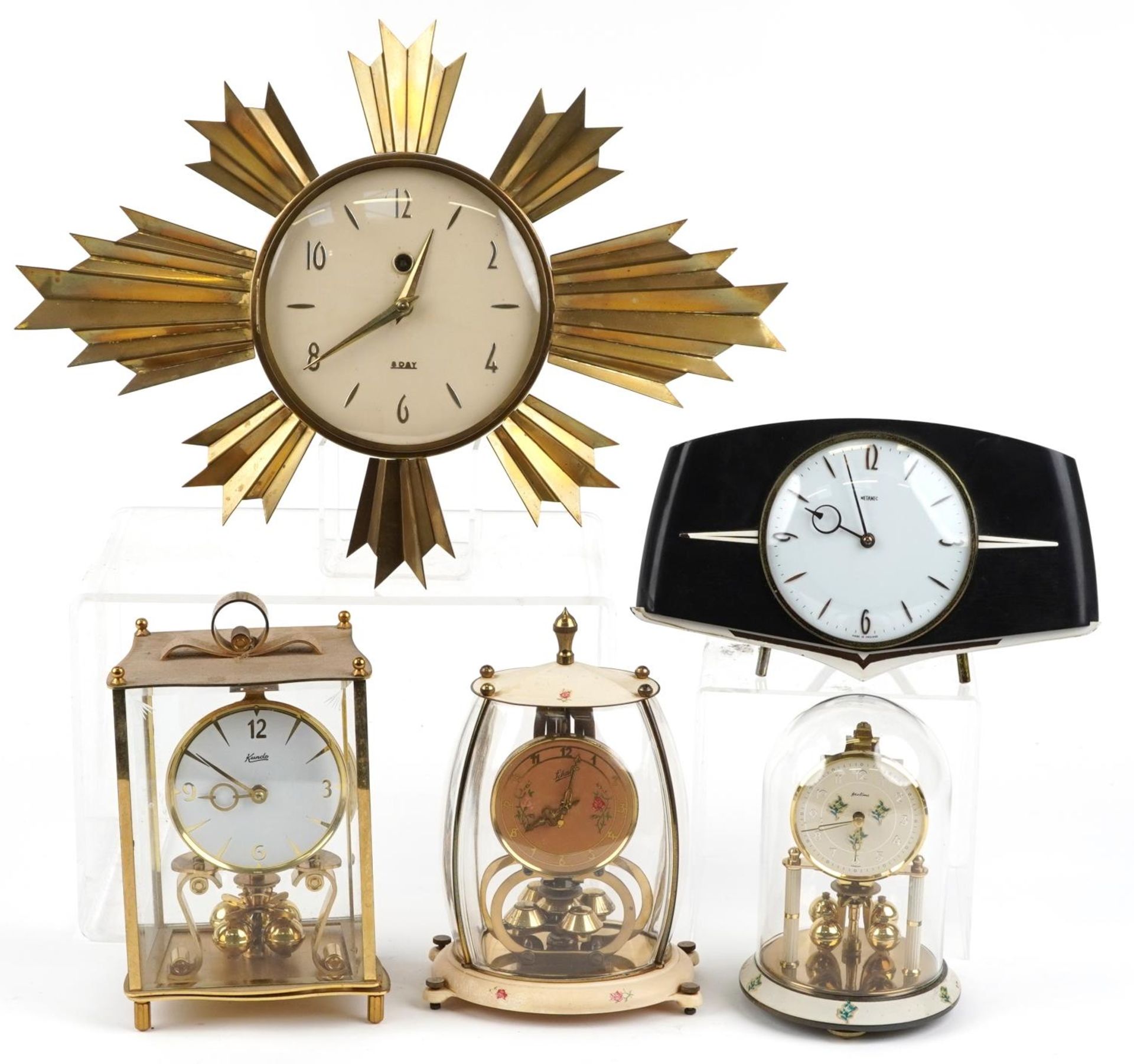 Five mid century and later clocks including a brass eight day sunburst design example, Kundo and