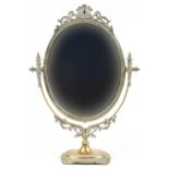 Vintage classical brass swing mirror with urn finials, 52cm high
