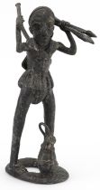 African tribal interest patinated metal figure of a tribesman, possibly Benin, 34cm high