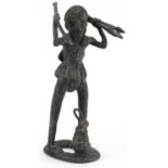 African tribal interest patinated metal figure of a tribesman, possibly Benin, 34cm high