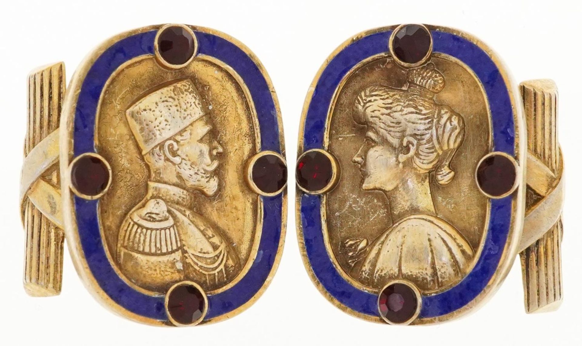 Pair of silver gilt and blue enamel portrait cufflinks set with red stones, impressed Russian marks,