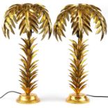 Pair of Hollywood Regency style gilt painted table lamps in the form of palm trees, each 73cm high