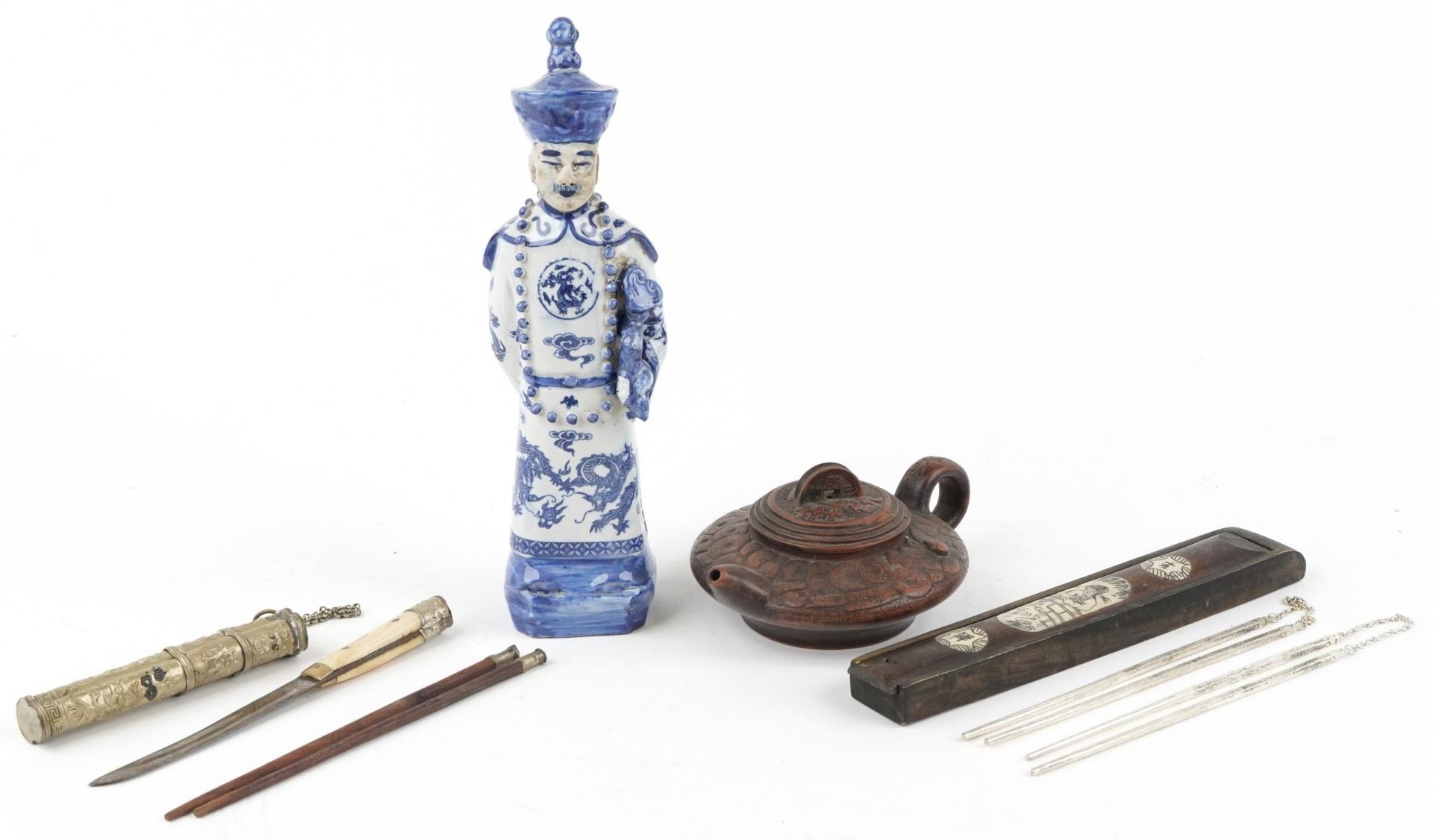 Chinese sundry items including a blue and white porcelain emperor and two pairs of white metal