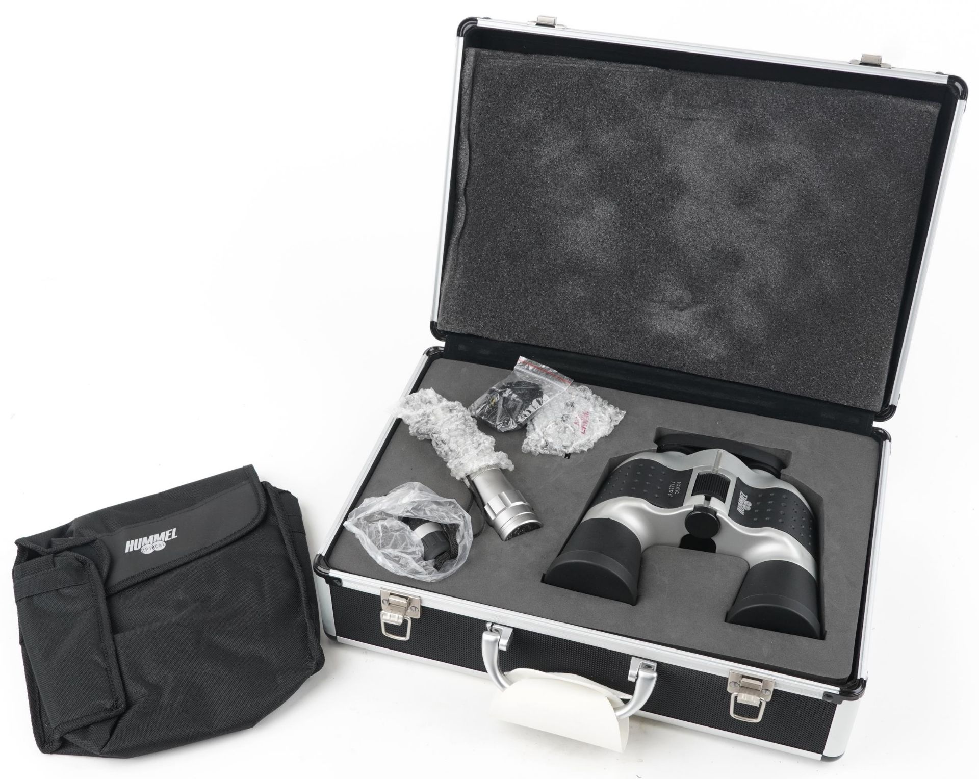 As new Hummel optical set housed in a fitted aluminium travel case comprising a pair of 10 x 50