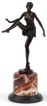 Patinated bronze statuette of a semi nude Art Deco female dancer raised on a circular marble and