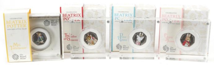 Four Beatrix Potter silver proof fifty pence pieces by The Royal Mint with display blocks and boxes,
