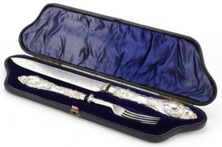 Victorian silver handled knife and fork with silver plated blades housed in a velvet and silk