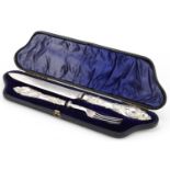 Victorian silver handled knife and fork with silver plated blades housed in a velvet and silk