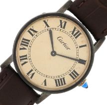 Cartier, gentlemen's silver wristwatch having cream dial with Roman numerals and cabochon sapphire