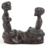 African tribal interest hardwood carving of two figures and two serpents, 10cm wide