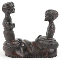 African tribal interest hardwood carving of two figures and two serpents, 10cm wide