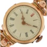 9ct gold ladies manual wind wristwatch having enamelled dial with Roman numerals and 9ct rose gold