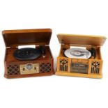 Two retro wooden record/CD and radio players, the largest, 46cm wide