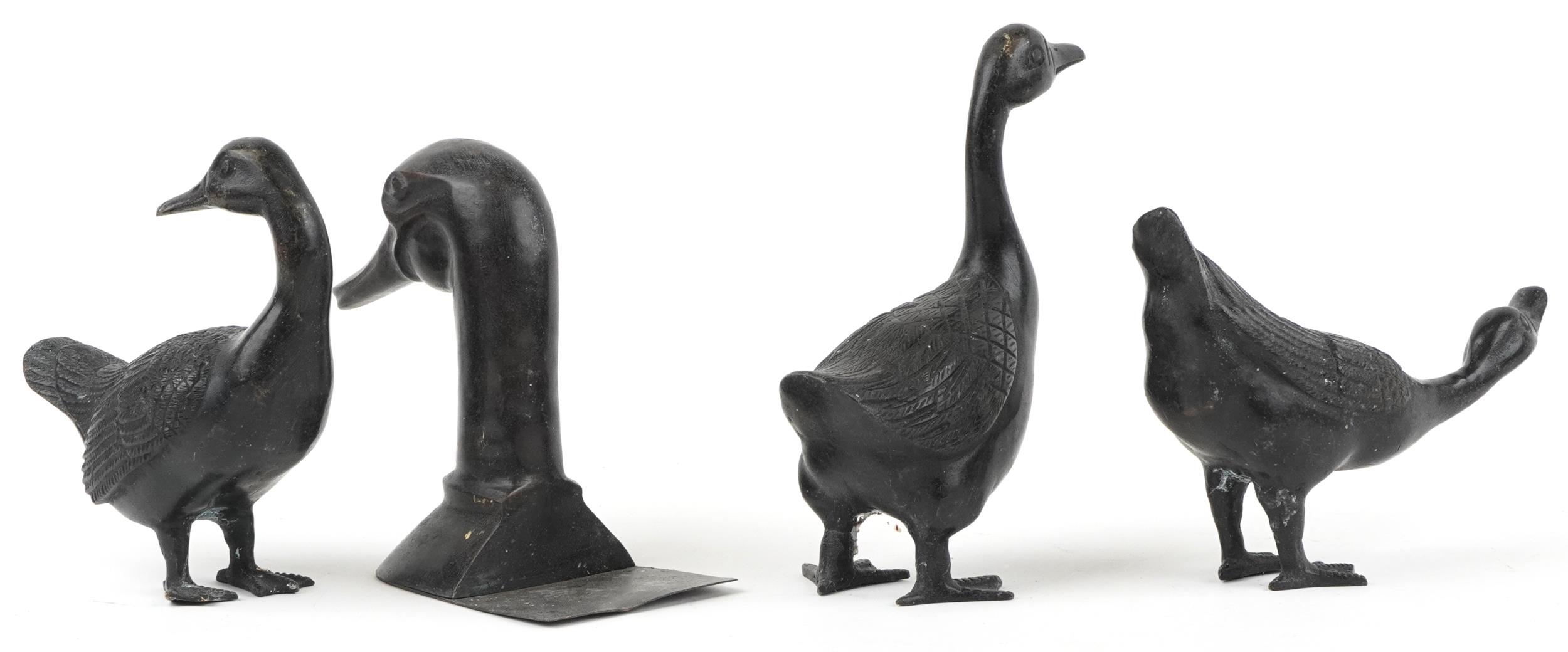 Three patinated bronze ducks and a patinated bronze book end in the form of a duck's head, the - Image 2 of 3