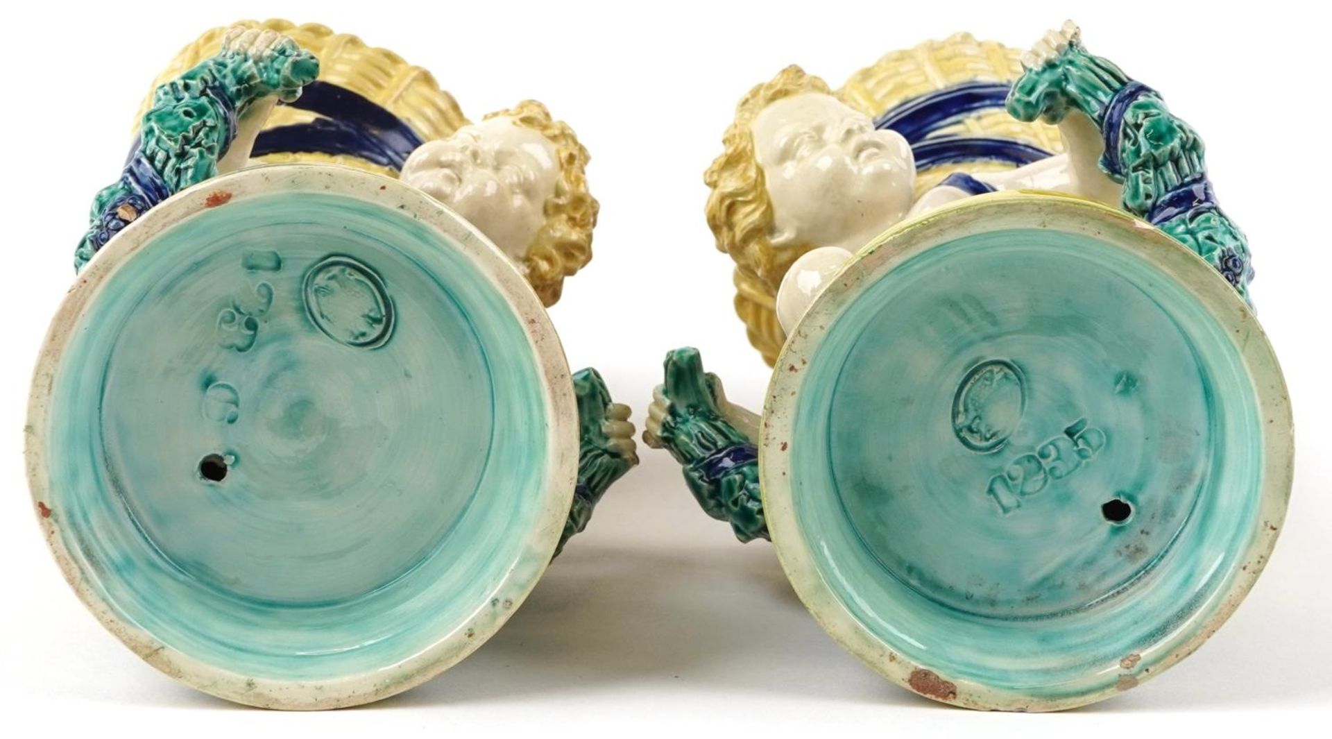 Pair of 19th century European Maiolica vases in the form of Putti carrying cornucopia, each with - Image 3 of 4