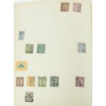 Standard postage stamp album housing various 19th century and later world stamps including Canton