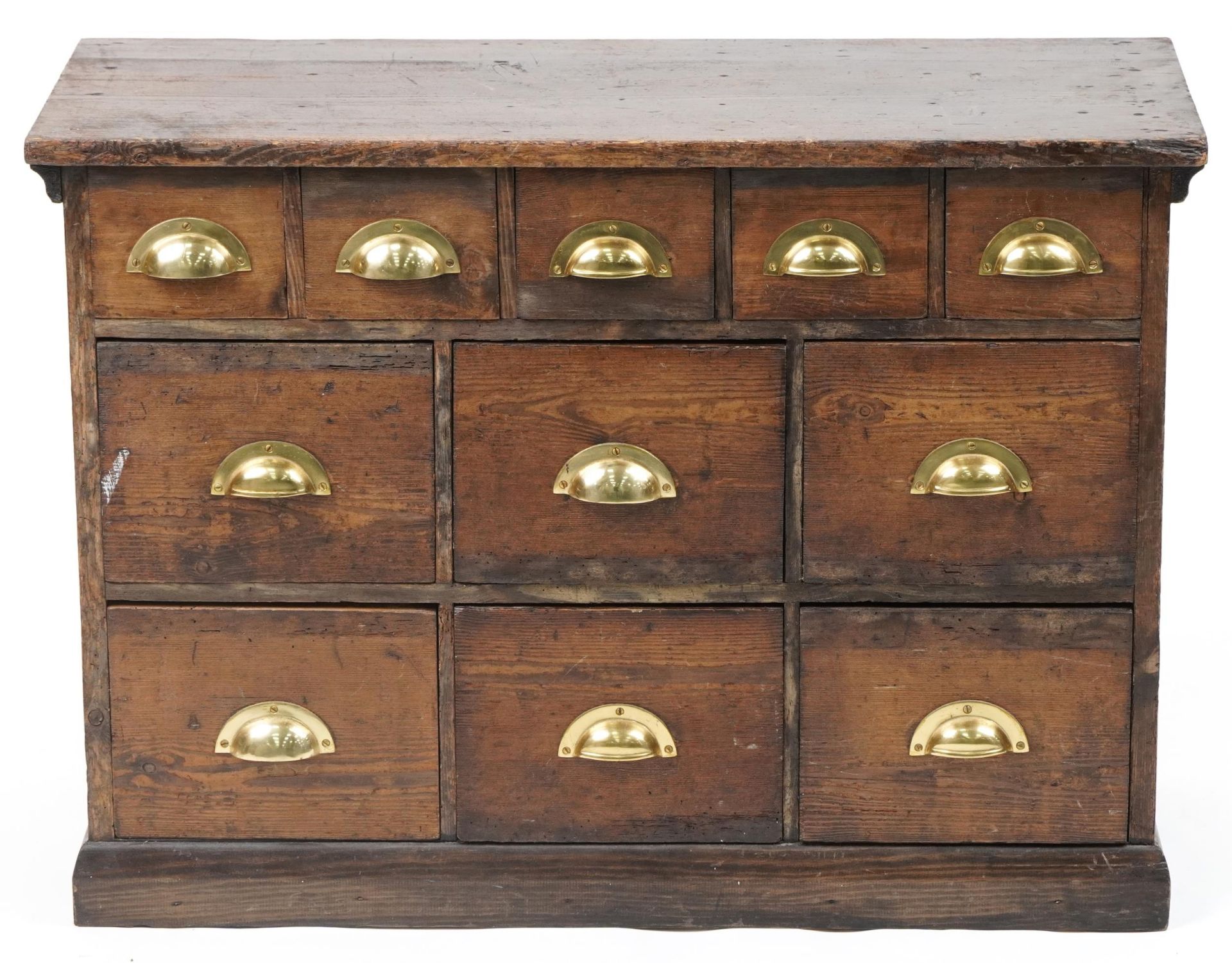 Stained pine haberdashery chest fitted with an arrangement of eleven drawers having brass handles, - Image 2 of 4