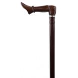 Hardwood walking stick with carved hardwood foot design handle and white metal collar, 95.5cm in