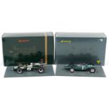 Two Spark 1:18 scale diecast model racing vehicles with boxes and display stands comprising BRM