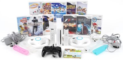 Nintendo Wii games console with controllers, accessories and a collection of games