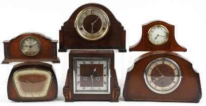 Five oak cased mantle clocks and an inlaid mahogany example, two with Westminster chime, the largest