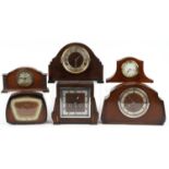 Five oak cased mantle clocks and an inlaid mahogany example, two with Westminster chime, the largest