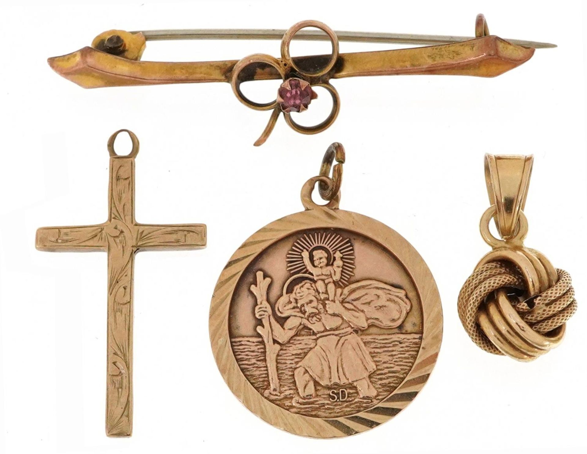 9ct gold jewellery comprising St Christopher pendant, engraved cross pendant, knot design pendant