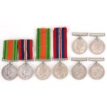 Eight British military World War II medals with various ribbons including Defence examples