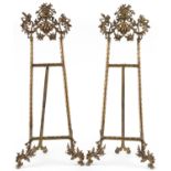 Pair of large Rococo style brass easel stands, each 78cm high