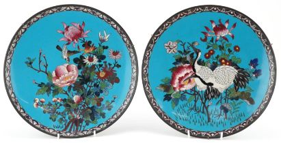 Matched pair of Japanese cloisonne plates enamelled with cranes and a bird amongst flowers, each