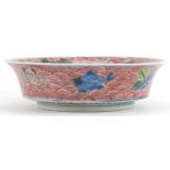 Chinese porcelain bowl hand painted in the famille verte palette with fish amongst crashing waves,