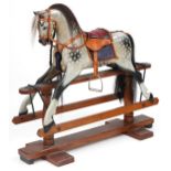 Stevenson Brothers gesso dapple grey rocking horse on stand, 96cm high x 104cm in length