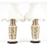 Large pair of Chinese hexagonal vase table lamps raised on hardwood stands with silk lined shades,