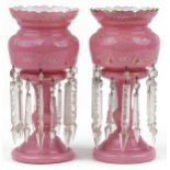 Pair of Victorian pink opaline glass lustres with drops, each enamelled with flowers, each 31.5cm