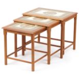 Nest of three mid century Danish teak occasional tables with inset tiled tops, the largest 48cm H