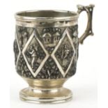 Grish Chunder of Calcutta, Indian unmarked silver christening tankard embossed with villagers and