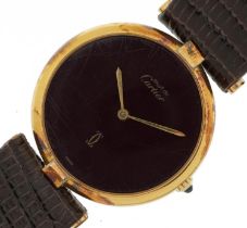 Cartier, ladies silver gilt Must de Cartier wristwatch having a burgundy dial with box and