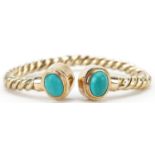 Unmarked gold rope twist and cabochon turquoise bangle, tests as 15ct gold, 6.5cm wide, 13.5g