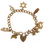 9ct gold charm bracelet with a collection of mostly 9ct gold charms including London Bridge, animals