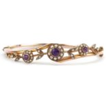 Victorian 9ct rose gold amethyst and seed pearl floral crossover hinged bangle housed in a velvet