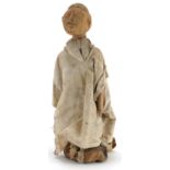 Tribal interest carved wood Voodoo doll wearing a white cape, possibly from South Sea Islands, 35.