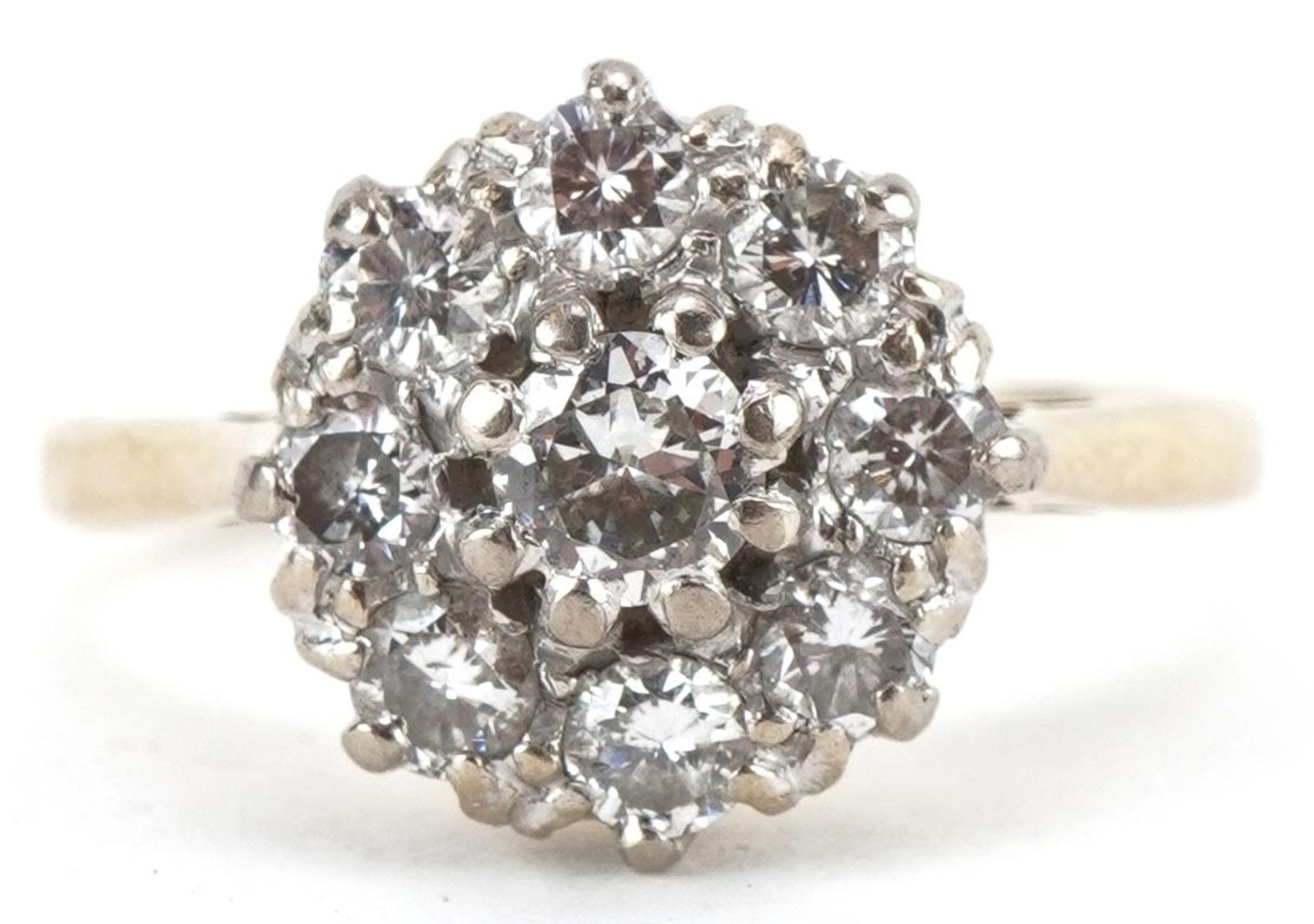 18ct gold diamond cluster ring, the central diamond approximately 0.20 carat, size N, 3.6g