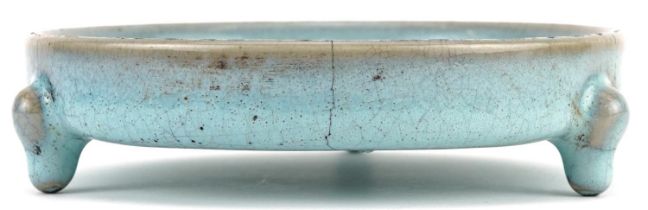 Chinese porcelain tripod censer having a blue crackle glaze, 14cm in diameter excluding the feet