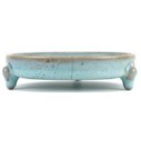 Chinese porcelain tripod censer having a blue crackle glaze, 14cm in diameter excluding the feet