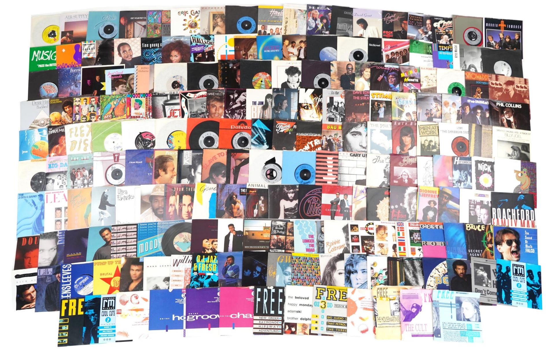45rpm records arranged in three cases including Eric Clapton, Phil Collins, The Stranglers and