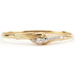 14ct gold cubic zirconia hinged bangle, 6.5cm wide, 8.9g