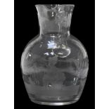 Victorian glass water jug etched with ferns and a pipe smoking female sitting on a chamber pot, 14.