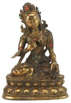 Chino Tibetan patinated bronze figure of seated Buddha with cabochons, character marks to the