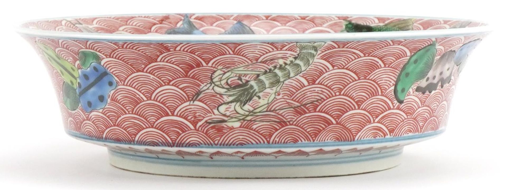 Chinese porcelain bowl hand painted in the famille verte palette with fish amongst crashing waves, - Image 2 of 7